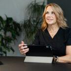 Spa business owner with plants representing the power change in business growth