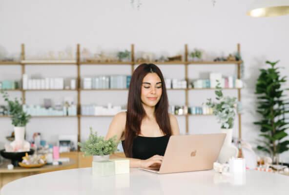 Salon and spa owner reading The Check-In newsletter