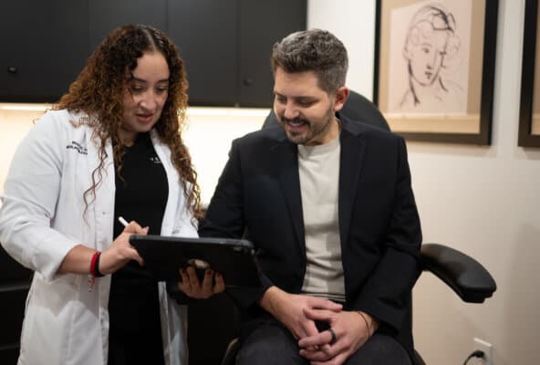 Medspa provider reviewing personalized treatment plan with client during consultation