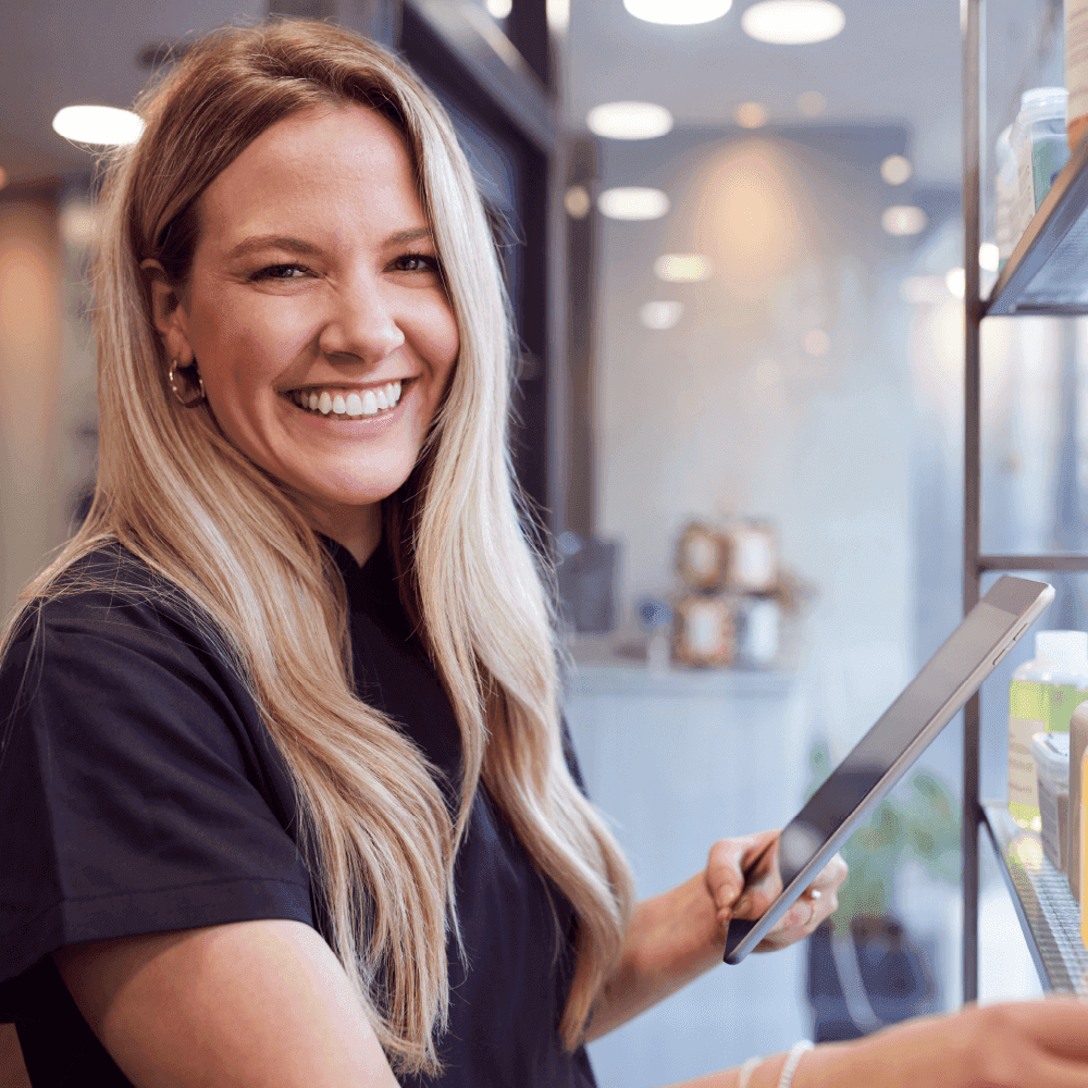 Salon owner choosing a online scheduling app