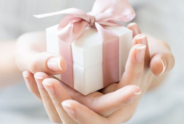 Small present representing beauty and wellness gift cards for expanded revenue