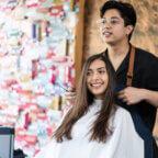 Hair stylist benefitting from must-have features in online booking software