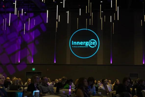 Innergize 2024 display with a crowd of beauty and wellness professionals