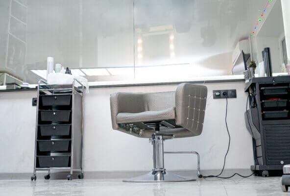 Empty salon chair representing a no-show appointment