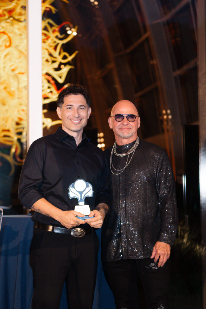 Salon stylist of the year, Omar Aguila, with award presenter Van Council, co-founder of Van Michael Salon